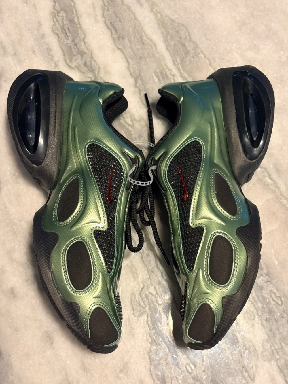Nike Women's Air Max Muse sneakers in the "Metallic Oil Green"